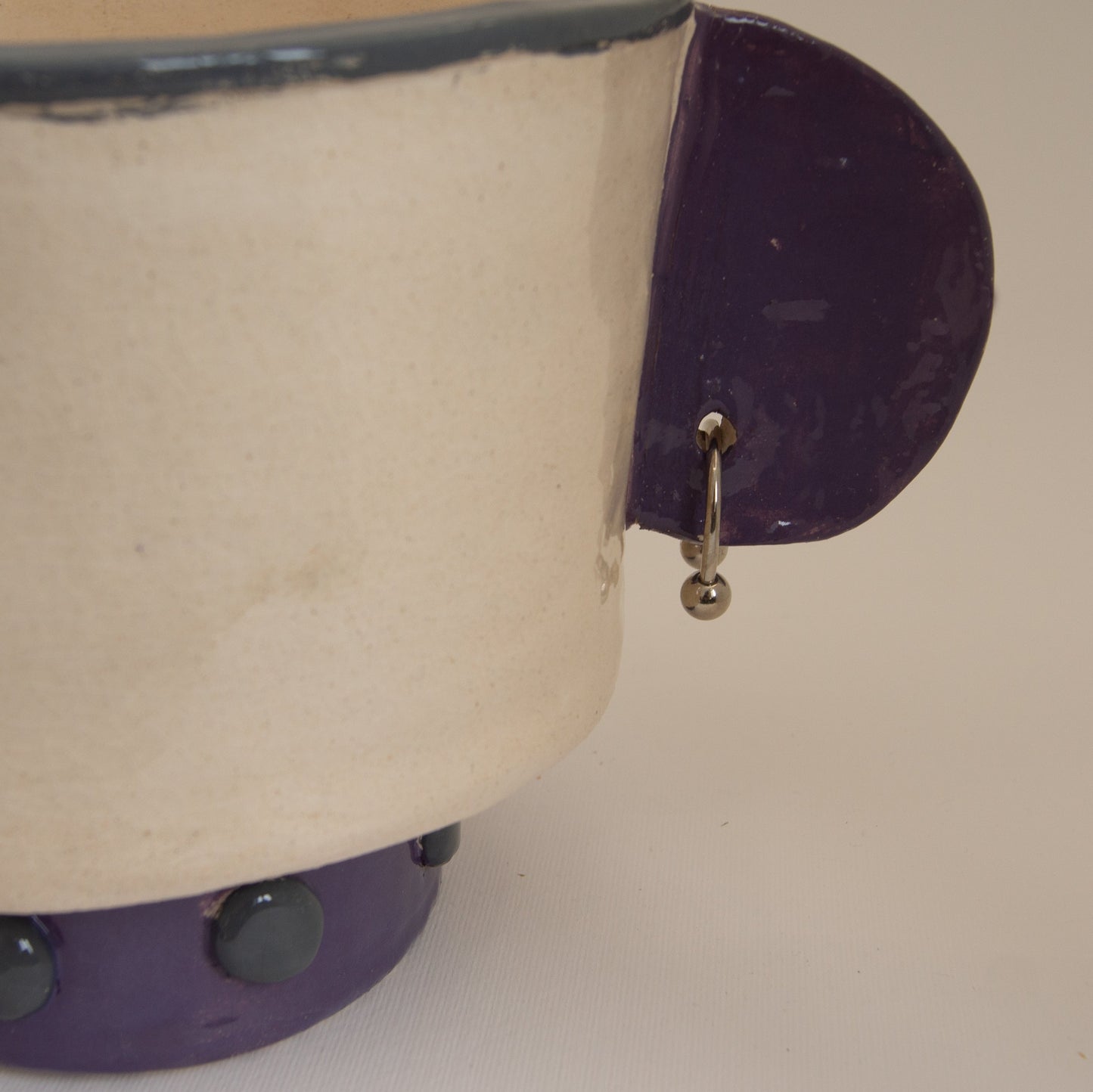 Sculptural vase with metal rings