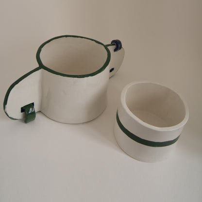 Handcrafted vase with unique ear motifs and glossy finish.