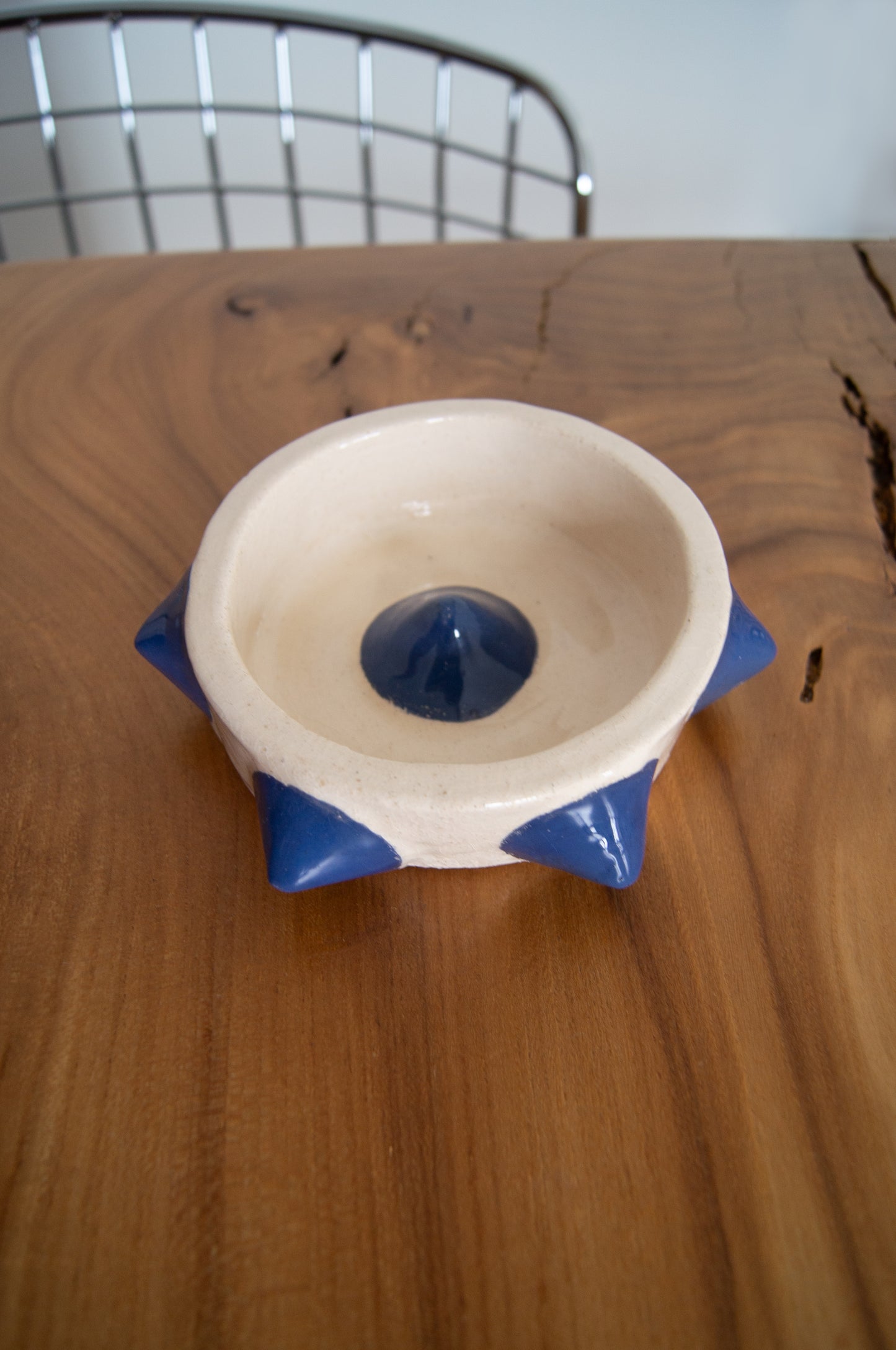 Handcrafted ashtray combining art and utility.