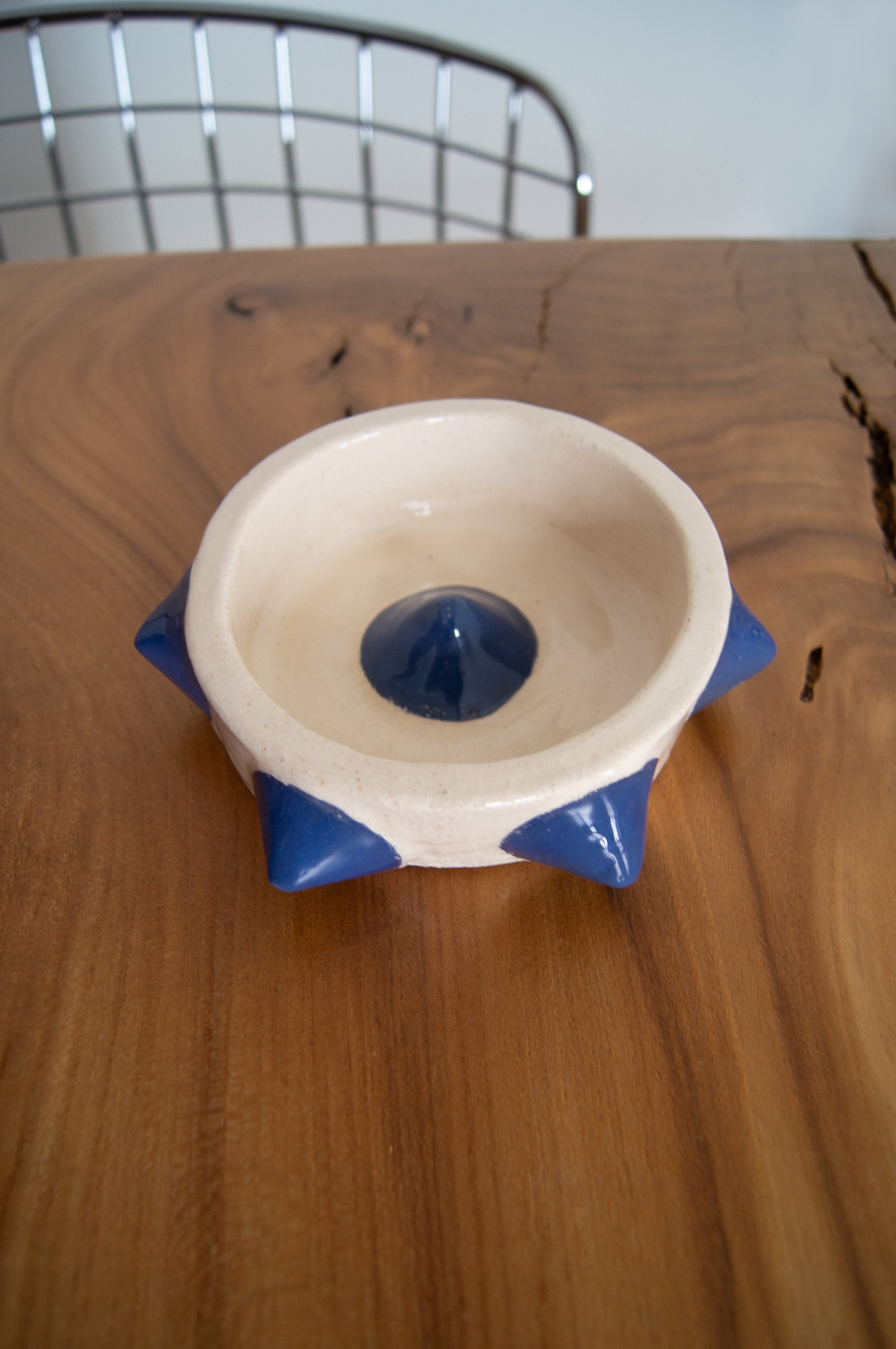 Handcrafted ashtray combining art and utility.