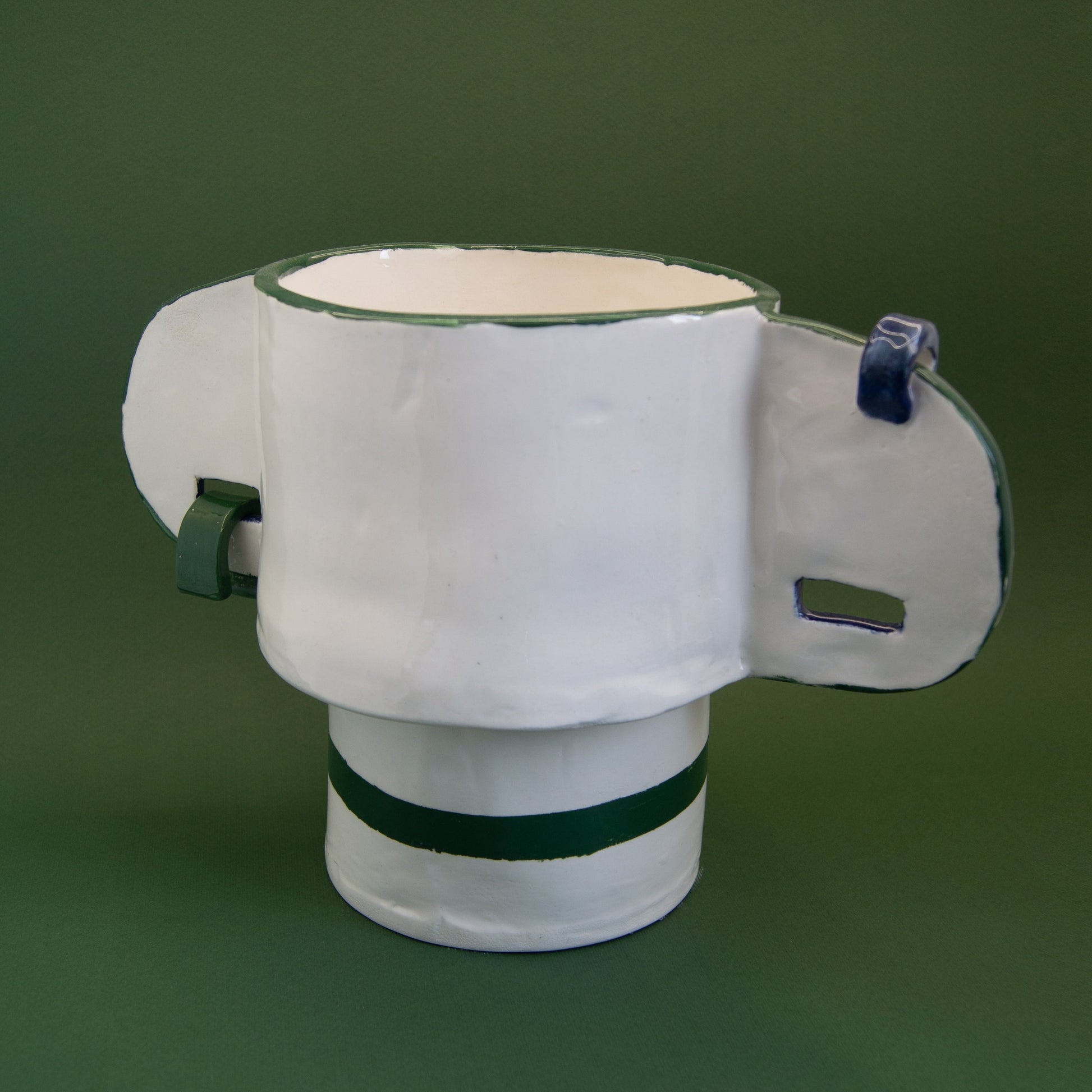 Green ceramic vase featuring ear-shaped handles with metal rings.