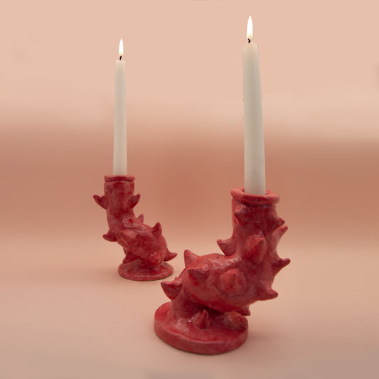 Red candlesticks with ceramic thorns